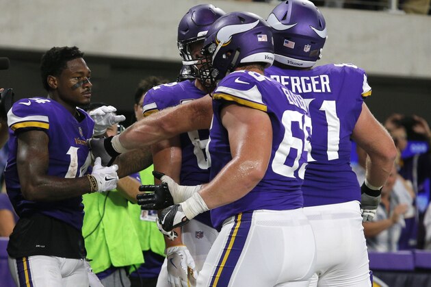 Minnesota Vikings wide receiver Stefon Diggs, left, celebrates with teammates after catching a 2-yard touchdown pass during the first half of an NFL football game against the New Orleans Saints, Monday, Sept. 11, 2017, in Minneapolis. (AP Photo/Bruce Kluckhohn)