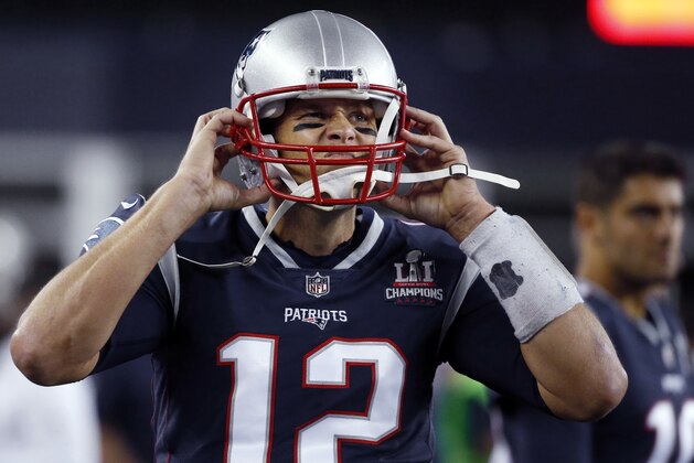 New England Patriots quarterback Tom Brady adjusts his helmet on the sideline during the first half of an NFL football game against the Kansas City Chiefs, Thursday, Sept. 7, 2017, in Foxborough, Mass. The Chiefs defeated the Patriots 42-27. The good news for New England is that the last three times it lost its season opener it went on the win the Super Bowl. (AP Photo/Michael Dwyer)