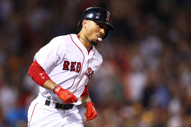 BOSTON, MA - SEPTEMBER 12: Mookie Betts #50 of the Boston Red Sox rounds the bases after hitting a two run home run against the Oakland Athletics during the fourth inning at Fenway Park on September 12, 2017 in Boston, Massachusetts. (Photo by Maddie Meyer/Getty Images)