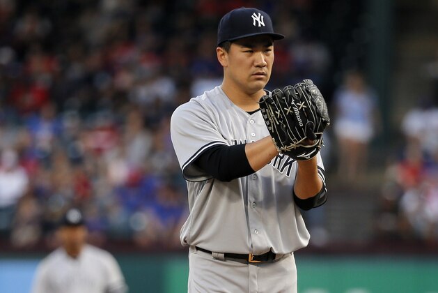 New York Yankees' Masahiro Tanaka of Japan prepares to throw to the Texas Rangers in the first inning of a baseball game, Friday, Sept. 8, 2017, in Arlington, Texas. (AP Photo/Tony Gutierrez)