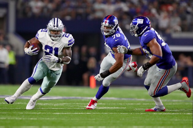 ARLINGTON, TX - SEPTEMBER 10:  Ezekiel Elliott #21 of the Dallas Cowboys carries the ball against B.J. Goodson #93 of the New York Giants and Romeo Okwara #78 of the New York Giants in the fourth quarter at AT&T Stadium on September 10, 2017 in Arlington, Texas.  (Photo by Tom Pennington/Getty Images)
