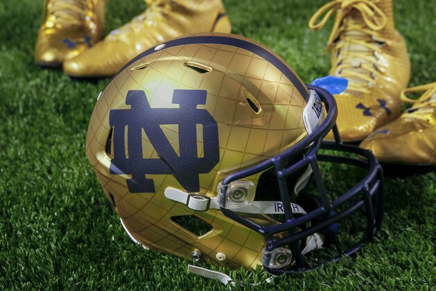 INDIANAPOLIS, IN - SEPTEMBER 13: General view of a Notre Dame Fighting Irish helmet on the field during the game against the Purdue Boilermakers at Lucas Oil Stadium on September 13, 2014 in Indianapolis, Indiana.  (Photo by Michael Hickey/Getty Images)