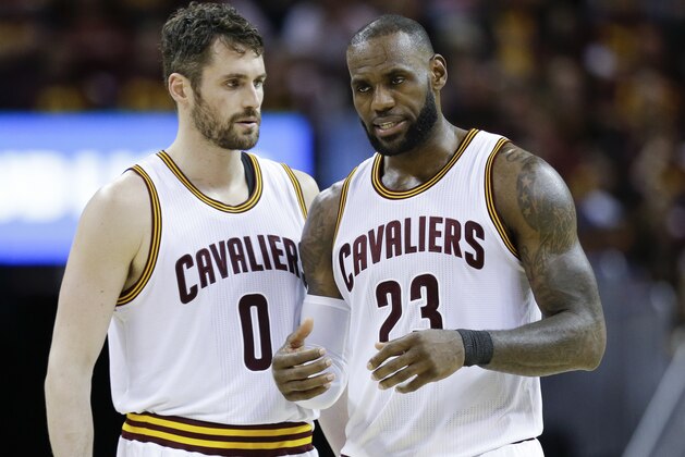 Cleveland Cavaliers' LeBron James (23) talks with Kevin Love (0) against the Boston Celtics during the second half of Game 3 of the NBA basketball Eastern Conference finals, Sunday, May 21, 2017, in Cleveland. The Celtics won 111-108. (AP Photo/Tony Dejak)