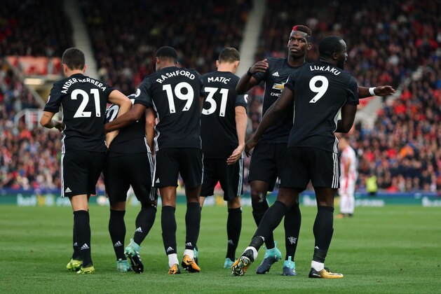 STOKE ON TRENT, ENGLAND - SEPTEMBER 09: Romelu Lukaku of Manchester United celebrates with his team mates after scoring a goal to make it 1-2 during the Premier League match between Stoke City and Manchester United at Bet365 Stadium on September 9, 2017 in Stoke on Trent, England. (Photo by James Baylis - AMA/Getty Images)