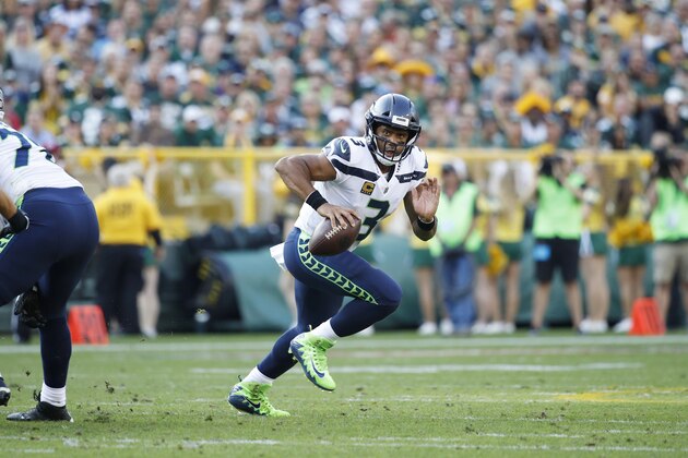 GREEN BAY, WI - SEPTEMBER 10: Russell Wilson #3 of the Seattle Seahawks looks to pass during a game against the Green Bay Packers at Lambeau Field on September 10, 2017 in Green Bay, Wisconsin. The Packers won 17-9. (Photo by Joe Robbins/Getty Images)