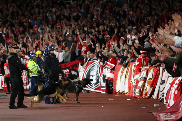 LONDON, ENGLAND - SEPTEMBER 14:  Riot police with dogs stand infront of the  FC Koeln fans ahead of the UEFA Europa League group H match between Arsenal FC and 1. FC Koeln at Emirates Stadium on September 14, 2017 in London, United Kingdom.  (Photo by Richard Heathcote/Getty Images)