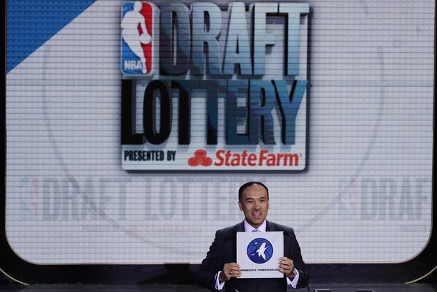 NBA deputy commissioner Mark Tatum announces the draft position for the Minnesota Timberwolves during the NBA basketball draft lottery, Tuesday, May 16, 2017, in New York. (AP Photo/Frank Franklin II)