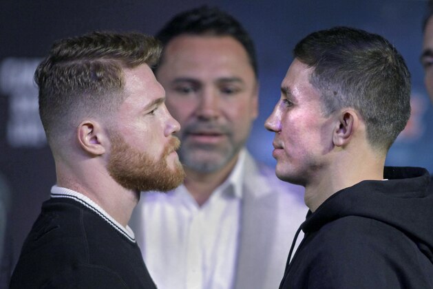 Boxers Canelo Alvarez (L) and Gennady Golovkin face-off during their final press conference at MGM Grand Hotel & Casino on September 13, 2017 in Las Vegas, Nevada. 
Alvarez will challenge WBC, WBA and IBF middleweight champion Gennady Golovkin for his titles at T-Mobile Arena on September 16 in Las Vegas. / AFP PHOTO / John GURZINSKI        (Photo credit should read JOHN GURZINSKI/AFP/Getty Images)