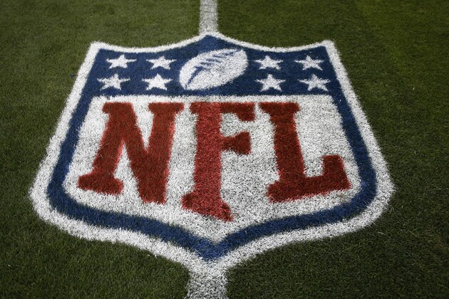 The NFL logo is shown at mid field prior to an NFL preseason football game between the Denver Broncos and the Arizona Cardinals, Thursday, Aug. 31, 2017, in Denver. (AP Photo/Jack Dempsey)