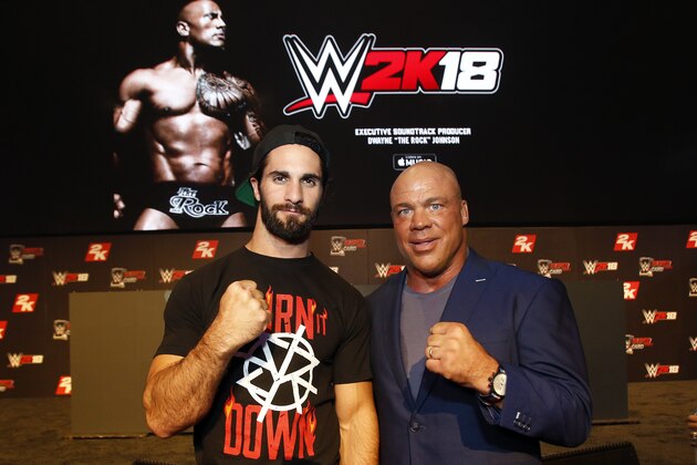 IMAGE DISTRIBUTED FOR 2K GAMES - WWE 2K18 Cover Superstar Seth Rollins and WWE Hall of Famer Kurt Angle seen at the WWE 2K18 SummerSlam Kickoff Event on Friday, Aug. 18, 2017, in New York. (Photo by Adam Hunger/Invision for 2K Games/AP Images)