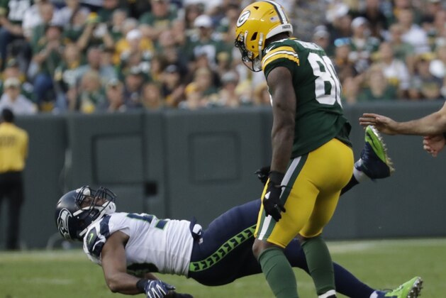 Green Bay Packers' Martellus Bennett is called for a personal foul for hitting Seattle Seahawks' K.J. Wright after a play during the second half of an NFL football game Sunday, Sept. 10, 2017, in Green Bay, Wis. (AP Photo/Morry Gash)