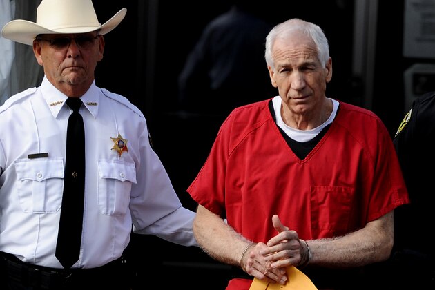 BELLEFONTE, PA - OCTOBER 09: Former Penn State assistant football coach Jerry Sandusky leaves the Centre County Courthouse after being sentenced in his child sex abuse case on October 9, 2012 in Bellefonte, Pennsylvania. The 68-year-old Sandusky was sentenced to at least 30 years and not more that 60 years in prison for his conviction in June on 45 counts of child sexual abuse, including while he was the defensive coordinator for the Penn State college football team. (Photo by Patrick Smith/Getty Images)