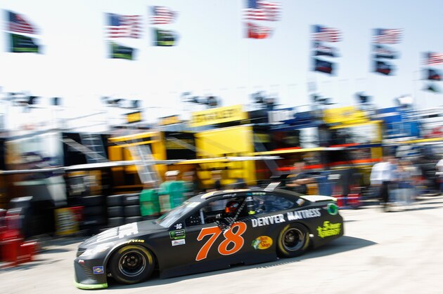 JOLIET, IL - SEPTEMBER 15:  Martin Truex Jr. drives the #78 Furniture Row/Denver Mattress Toyota through the garage area during practice for the Monster Energy NASCAR Cup Series Tales of the Turtles 400 at Chicagoland Speedway on September 15, 2017 in Joliet, Illinois.  (Photo by Brian Lawdermilk/Getty Images)