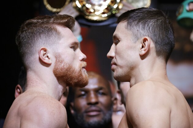 Canelo Alvarez, left, and Gennady Golovkin pose during a weigh-in Friday, Sept. 15, 2017, in Las Vegas. The two are scheduled to fight in a middleweight title fight Saturday in Las Vegas. (AP Photo/John Locher)