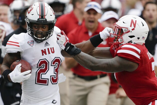 Northern Illinois running back Jordan Huff (23) is pushed out of bounds by Nebraska linebacker Mohamed Barry, right, during the first half of an NCAA college football game in Lincoln, Neb., Saturday, Sept. 16, 2017. (AP Photo/Nati Harnik)