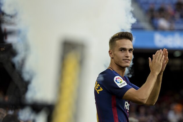 Barcelona's midfielder Denis Suarez waves to supporters before the 52nd Joan Gamper Trophy friendly football match between Barcelona FC and Chapecoense at the Camp Nou stadium in Barcelona on August 7, 2017.
Funds raised from the match will 'help Chapecoense rebuild institutionally and recover the competitive level it had before the tragedy', Barca said in a statement as the Brazilian side still reeling from a devastating plane crash that killed 19 players and 24 club officials last year. / AFP PHOTO / Josep LAGO        (Photo credit should read JOSEP LAGO/AFP/Getty Images)