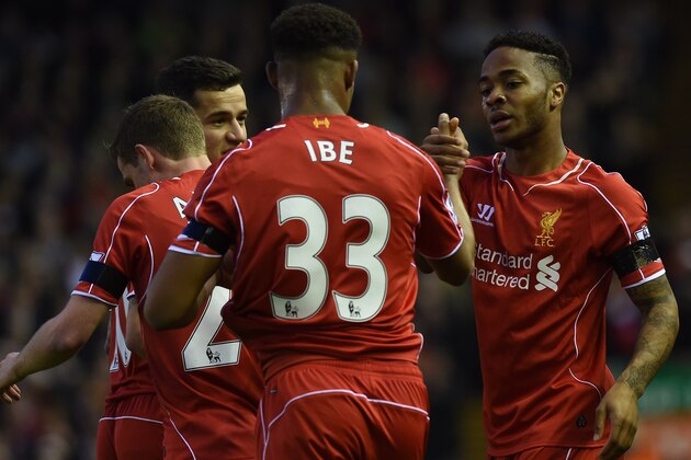 Liverpool's English midfielder Raheem Sterling (R) celebrates with Liverpool's English midfielder Jordon Ibe after scoring the opening goal of the English Premier League football match between Liverpool and Newcastle United at Anfield in Liverpool, north west England on April 13, 2015. AFP PHOTO / PAUL ELLIS

RESTRICTED TO EDITORIAL USE. NO USE WITH UNAUTHORIZED AUDIO, VIDEO, DATA, FIXTURE LISTS, CLUB/LEAGUE LOGOS OR LIVE SERVICES. ONLINE IN-MATCH USE LIMITED TO 45 IMAGES, NO VIDEO EMULATION. NO USE IN BETTING, GAMES OR SINGLE CLUB/LEAGUE/PLAYER PUBLICATIONS.        (Photo credit should read PAUL ELLIS/AFP/Getty Images)