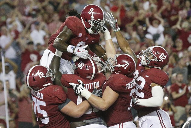 Alabama running back Bo Scarbrough celebrates with teammates after scoring a touchdown in the second half of an NCAA college football game against Colorado State, Saturday, Sept. 16, 2017, in Tuscaloosa, Ala. (AP Photo/Brynn Anderson)