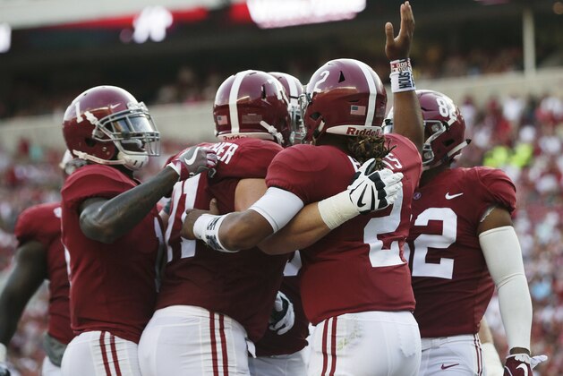 Alabama quarterback Jalen Hurts celebrates after scoring a touchdown in the first half of an NCAA college football game against Colorado State, Saturday, Sept. 16, 2017, in Tuscaloosa, Ala. (AP Photo/Brynn Anderson)