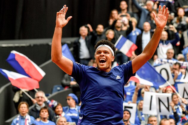 TOPSHOT - France's player Jo-Wilfried Tsonga reacts after winning the Davis Cup World Group semi-final tennis match against Serbia at The Pierre Mauroy Stadium in Lille on September 17, 2017. 
Tsonga fought back from a set down  to book France a place in the Davis Cup final with a semi-final win over Serbia in Lille.  France are into their fourth Davis Cup final since the last time they won the trophy in 2001, and first since losing to Roger Federer's Switzerland in 2014. / AFP PHOTO / PHILIPPE HUGUEN        (Photo credit should read PHILIPPE HUGUEN/AFP/Getty Images)