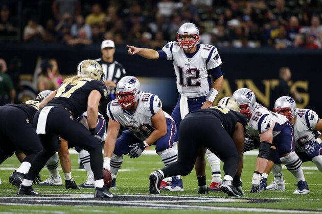 New England Patriots quarterback Tom Brady (12) calls an audible from the line of scrimmage in the second half of an NFL football game against the New Orleans Saints in New Orleans, Sunday, Sept. 17, 2017. (AP Photo/Butch Dill)