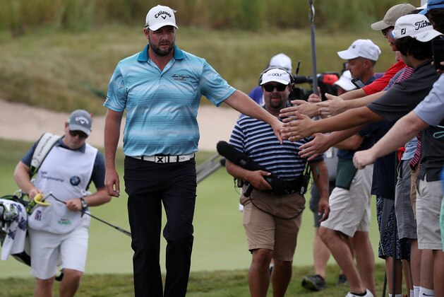 LAKE FOREST, IL - SEPTEMBER 17:  Marc Leishman of Australia greets fans as he walks to the fourth tee during the final round of the BMW Championship at Conway Farms Golf Club on September 17, 2017 in Lake Forest, Illinois.  (Photo by Gregory Shamus/Getty Images)