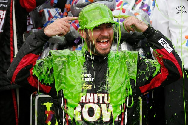 JOLIET, IL - SEPTEMBER 17:  Martin Truex Jr., driver of the #78 Furniture Row/Denver Mattress Toyota, celebrates in victory lane after winning  during the Monster Energy NASCAR Cup Series Tales of the Turtles 400 at Chicagoland Speedway on September 17, 2017 in Joliet, Illinois.  (Photo by Brian Lawdermilk/Getty Images)