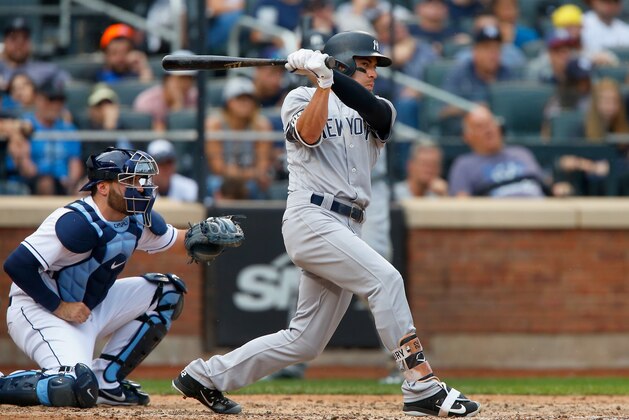 NEW YORK, NY - SEPTEMBER 13:  Jacoby Ellsbury #22 of the New York Yankees follows through on an eighth inning double against the Tampa Bay Rays at Citi Field on September 13, 2017 in the Flushing neighborhood of the Queens borough of New York City. The two teams were scheduled to play in St. Petersburg, Florida but due to the weather emergency caused by Hurricane Irma, the game was moved to New York, but with Tampa Bay remaining the 'home' team.  (Photo by Jim McIsaac/Getty Images)