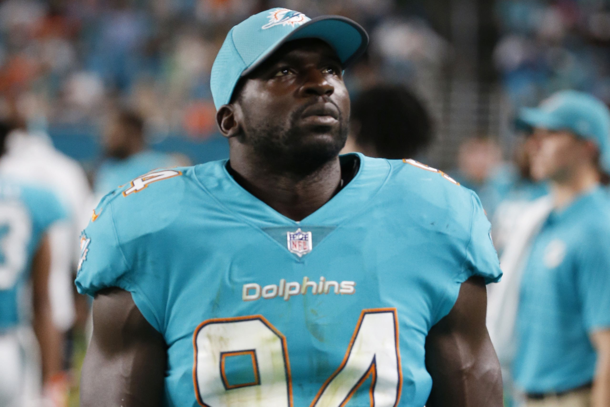 Miami Dolphins linebacker Lawrence Timmons (94) walks the sidelines, during the second half of an NFL preseason football game against the Atlanta Falcons, Thursday, Aug. 10, 2017, in Miami Gardens, Fla. (AP Photo/Wilfredo Lee)