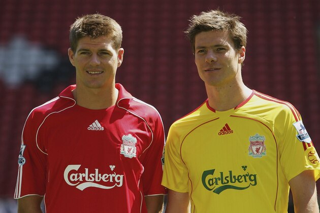 LIVERPOOL, UNITED KINGDOM - JULY 24:  Liverpool captain Steven Gerrard (L) and Xabi Alonso show off the new home and away kits during the Liverpool FC Adidas Kit Launch at Anfield on July 24, 2006 in Liverpool, England.  (Photo by Ian Walton/Getty Images for adidas)
