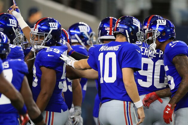 ARLINGTON, TX - SEPTEMBER 10:  Eli Manning #10 talks with  Brandon Marshall #15 of the New York Giants before a game against the Dallas Cowboys at AT&T Stadium on September 10, 2017 in Arlington, Texas.  (Photo by Ronald Martinez/Getty Images)