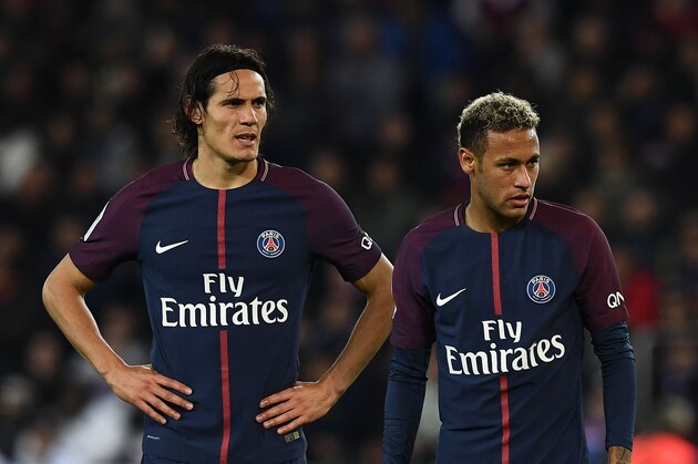 Paris Saint-Germain's Uruguayan forward Edinson Cavani (L) and Paris Saint-Germain's Brazilian forward Neymar react during the French Ligue 1 football match between Paris Saint-Germain (PSG) and Lyon (OL) on September 17, 2017 at the Parc des Princes stadium in Paris.  / AFP PHOTO / FRANCK FIFE        (Photo credit should read FRANCK FIFE/AFP/Getty Images)