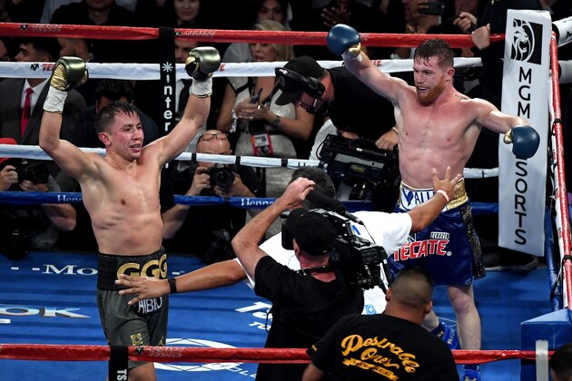 LAS VEGAS, NV - SEPTEMBER 16:  (L-R) Gennady Golovkin and Canelo Alvarez both celebrate after the final round in their WBC, WBA and IBF middleweight championship bout at T-Mobile Arena on September 16, 2017 in Las Vegas, Nevada.  (Photo by Ethan Miller/Getty Images)