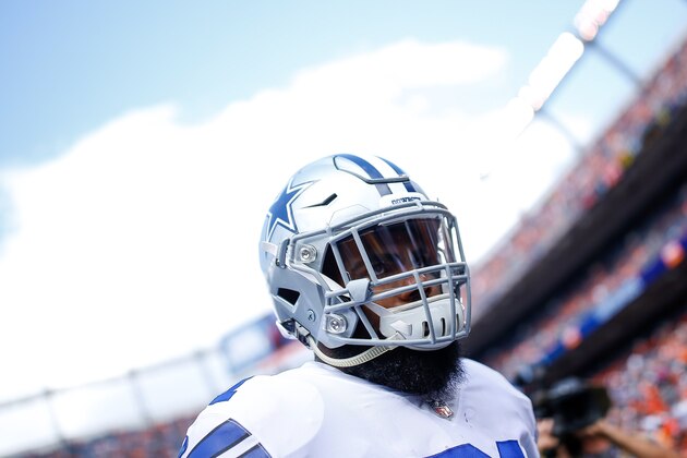 DENVER, CO - SEPTEMBER 17:  Running back Ezekiel Elliott #21 of the Dallas Cowboys stands on the field during player warm ups before a game against the Denver Broncos at Sports Authority Field at Mile High on September 17, 2017 in Denver, Colorado. (Photo by Justin Edmonds/Getty Images)