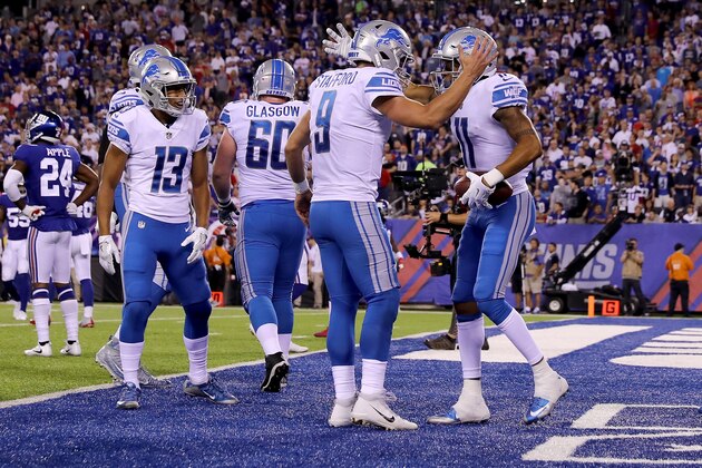 EAST RUTHERFORD, NJ - SEPTEMBER 18:  Marvin Jones #11 of the Detroit Lions celebrates with Matthew Stafford #9 after scoring a 27 yard touchdown in the first quarter against the New York Giants during their game at MetLife Stadium on September 18, 2017 in East Rutherford, New Jersey.  (Photo by Elsa/Getty Images)