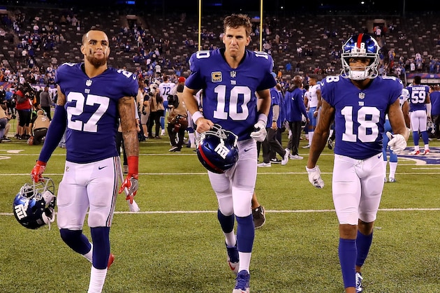 EAST RUTHERFORD, NJ - SEPTEMBER 18:    Darian Thompson#27, Eli Manning #10 and  Roger Lewis #18 of the New York Giants walk off the field after the game against the Detroit Lions on September 18, 2017 at MetLife Stadium in East Rutherford, New Jersey.  (Photo by Elsa/Getty Images)