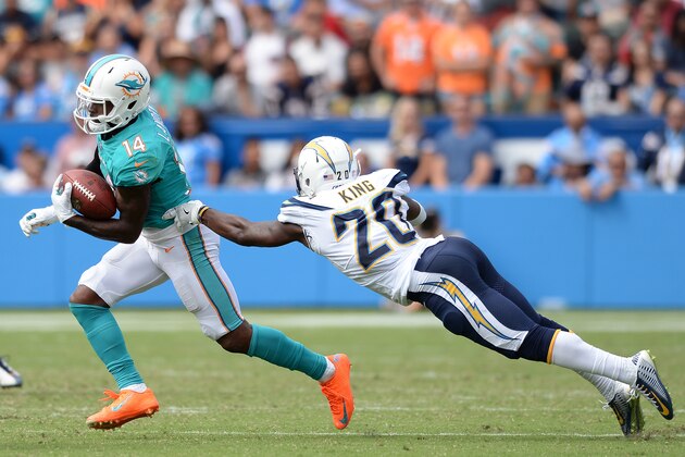 Sep 17, 2017; Carson, CA, USA; Miami Dolphins wide receiver Jarvis Landry (14) runs with the ball as Los Angeles Chargers defensive back Desmond King (20) attempts to make the tackle during the second half at StubHub Center. Mandatory Credit: Orlando Ramirez-USA TODAY Sports