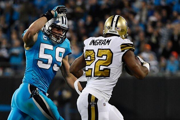 CHARLOTTE, NC - NOVEMBER 17:  Luke Kuechly #59 of the Carolina Panthers attempts to strip the ball from Mark Ingram #22 of the New Orleans Saints at Bank of America Stadium on November 17, 2016 in Charlotte, North Carolina.  (Photo by Mike Comer/Getty Images)