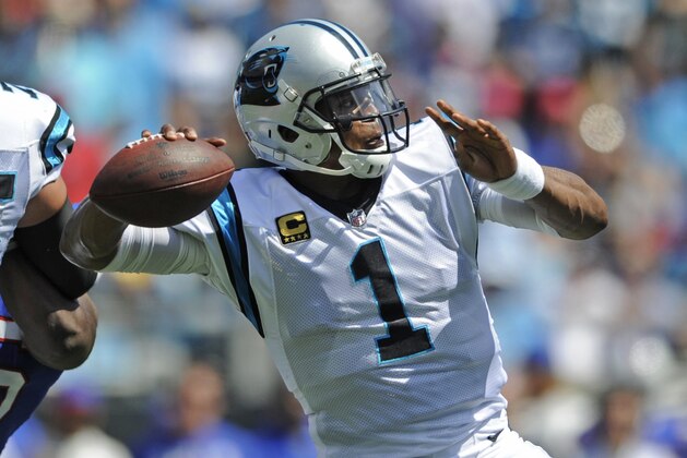 Carolina Panthers' Cam Newton (1) looks to pass against the Buffalo Bills in the first half of an NFL football game in Charlotte, N.C., Sunday, Sept. 17, 2017. (AP Photo/Mike McCarn)