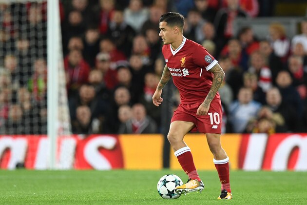Liverpool's Brazilian midfielder Philippe Coutinho passes the ball during the UEFA Champions League Group E football match between Liverpool and Sevilla at Anfield in Liverpool, north-west England on September 13, 2017. / AFP PHOTO / Paul ELLIS        (Photo credit should read PAUL ELLIS/AFP/Getty Images)
