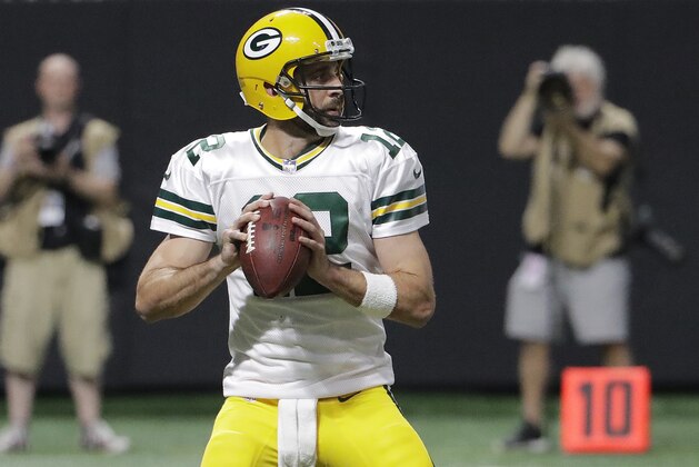 Green Bay Packers quarterback Aaron Rodgers (12) works against the Atlanta Falcons during the first of an NFL football game, Sunday, Sept. 17, 2017, in Atlanta. (AP Photo/David Goldman)