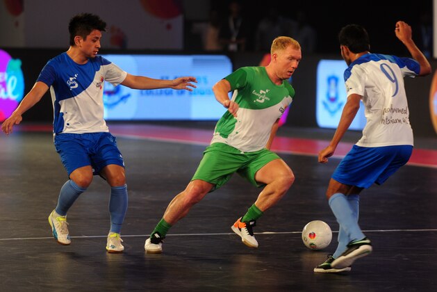 Bengaluru 5's Paul Scholes (C) plays against Goa 5's during their Premier Futsal Football League match in Chennai on July 17, 2016. / AFP / ARUN SANKAR        (Photo credit should read ARUN SANKAR/AFP/Getty Images)