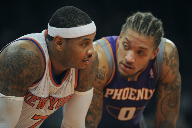 New York Knicks' Carmelo Anthony, left, and Phoenix Suns' Michael Beasley in the third quarter of the NBA basketball game  between the New York Knicks and Phoenix Suns at Madison Square Garden in New York, Sunday, Dec. 2, 2012. (AP Photo/Henny Ray Abrams)