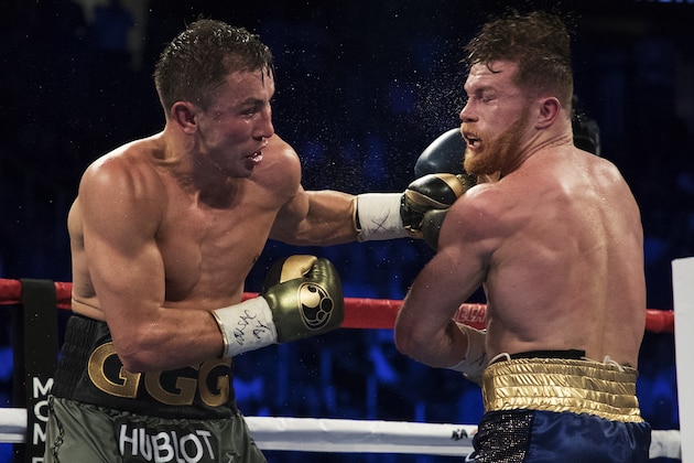 LAS VEGAS, NV - SEPTEMBER 16:  Gennady Golovkin punches Canelo Alvarez during their WBC, WBA and IBF middleweight championship bout at T-Mobile Arena on September 16, 2017 in Las Vegas, Nevada.  (Photo by Al Bello/Getty Images)