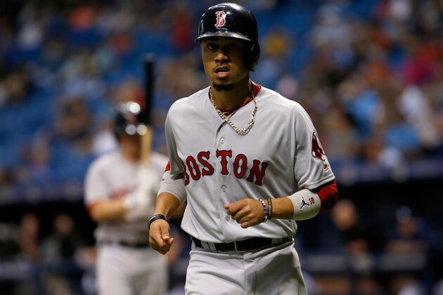 ST. PETERSBURG, FL - SEPTEMBER 16:  Mookie Betts #50 of the Boston Red Sox runs back to the dugout after scoring off of an RBI double by Rafael Devers during the sixth inning of a game against the Tampa Bay Rays on September 16, 2017 at Tropicana Field in St. Petersburg, Florida. (Photo by Brian Blanco/Getty Images)