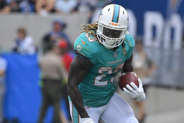 Miami Dolphins running back Jay Ajayi runs with the ball during the first half of an NFL football game against the Los Angeles Chargers Sunday, Sept. 17, 2017, in Carson, Calif. (AP Photo/Mark J. Terrill)