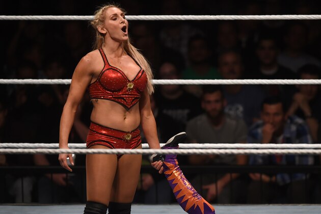 WWE wrestling stars Sasha Bank (R) and Charlotte Flair (L) fight during a WWE (World Wrestling Entertainment) women's fight at the Olympic hall in Munich, southern Germany, on November 3, 2016.  / AFP / CHRISTOF STACHE        (Photo credit should read CHRISTOF STACHE/AFP/Getty Images)