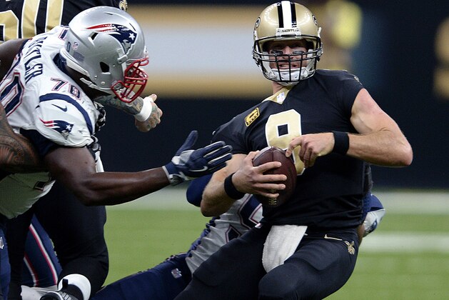New Orleans Saints quarterback Drew Brees (9) is sacked by New England Patriots defensive end Deatrich Wise as defensive tackle Adam Butler (70) closes in, in the second half of an NFL football game in New Orleans, Sunday, Sept. 17, 2017. (AP Photo/Bill Feig)