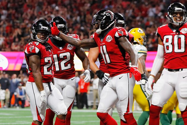 ATLANTA, GA - SEPTEMBER 17:  Devonta Freeman #24 of the Atlanta Falcons celebrates with Julio Jones #11 after scoring a 1-yard rushing touchdown during the first quarter against the Green Bay Packers at Mercedes-Benz Stadium on September 17, 2017 in Atlanta, Georgia.  (Photo by Kevin C. Cox/Getty Images)
