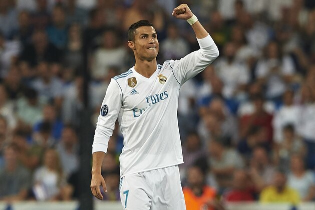 MADRID, SPAIN - SEPTEMBER 13:  Cristiano Ronaldo of Real Madrid celebrates scoring his team's second goal during the UEFA Champions League group H match between Real Madrid and APOEL Nikosia at Estadio Santiago Bernabeu on September 13, 2017 in Madrid, Spain.  (Photo by Manuel Queimadelos Alonso/Getty Images)